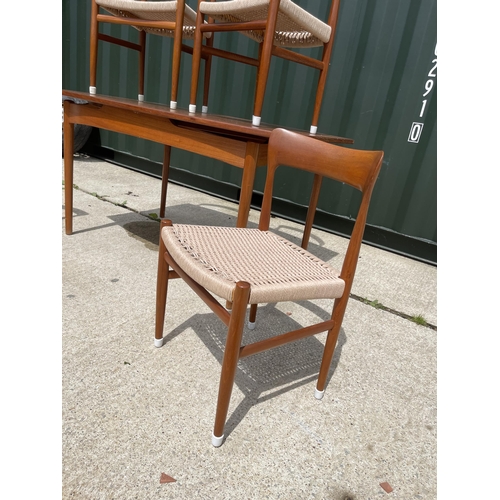 59 - Danish Teak draw leaf dining table together with a set of four Danish Teak dining chairs with string... 