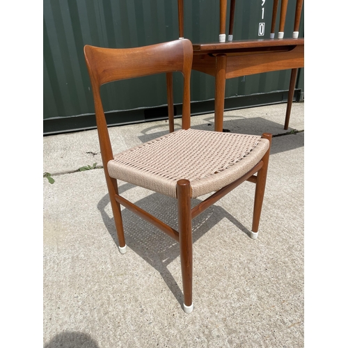 59 - Danish Teak draw leaf dining table together with a set of four Danish Teak dining chairs with string... 