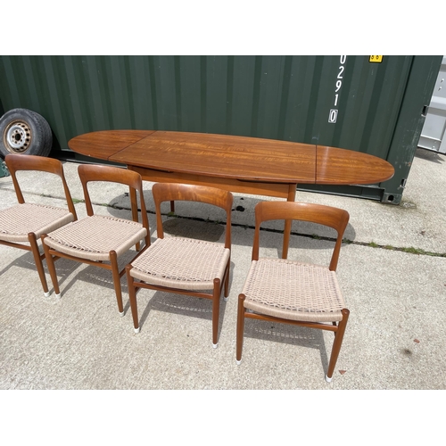 59 - Danish Teak draw leaf dining table together with a set of four Danish Teak dining chairs with string... 