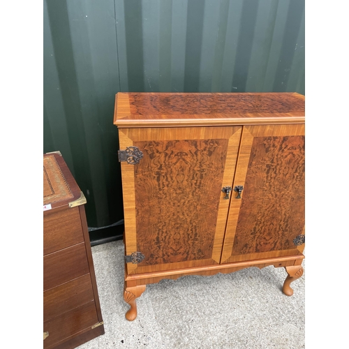 64 - Military style mahogany chest of four drawers together with repro yew cupboard