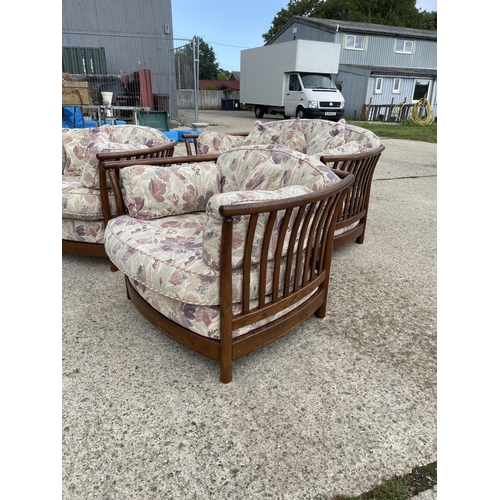 69 - Ercol Golden Dawn three piece lounge suite with patterned cushions