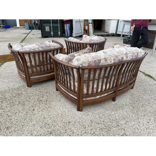 69 - Ercol Golden Dawn three piece lounge suite with patterned cushions