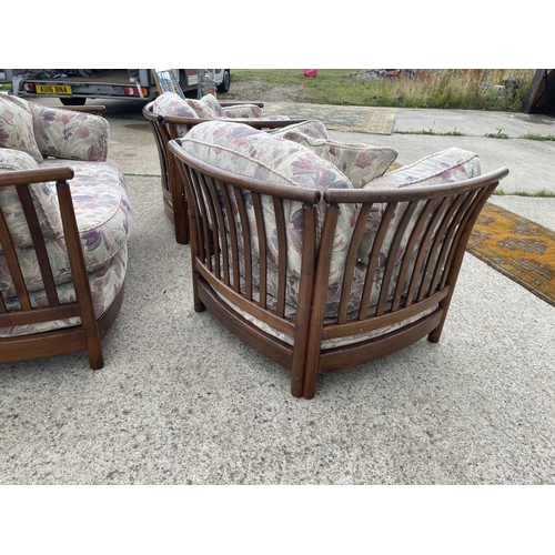 69 - Ercol Golden Dawn three piece lounge suite with patterned cushions