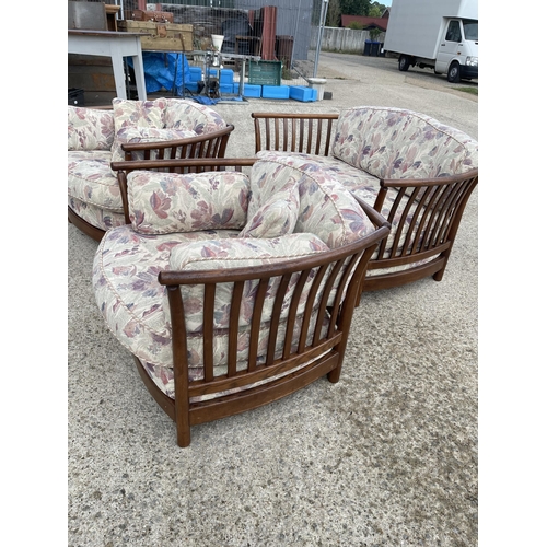 69 - Ercol Golden Dawn three piece lounge suite with patterned cushions