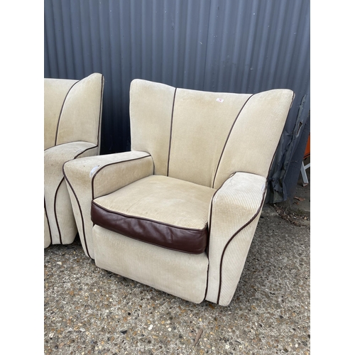 76 - A pair of deco style club armchairs