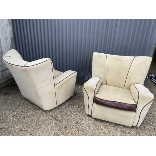 76 - A pair of deco style club armchairs