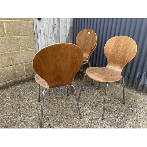 79 - Four bent ply stacking chairs