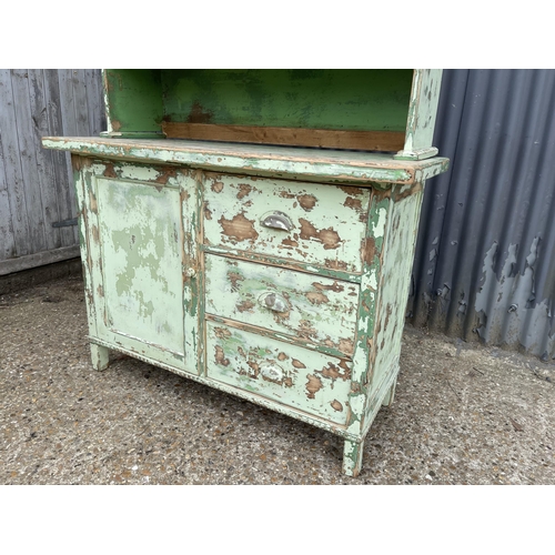 98 - A vintage green painted pine dresser with cupboard top and three drawer base 120x50x198