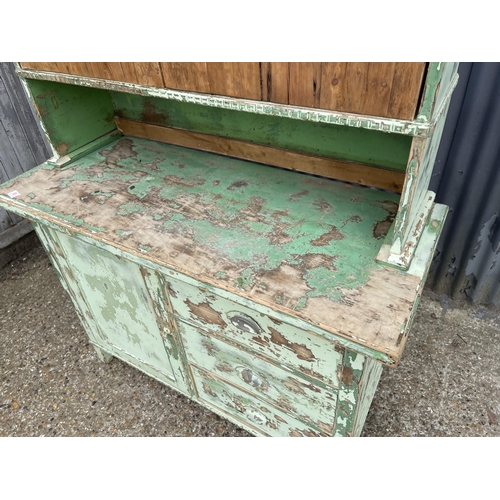 98 - A vintage green painted pine dresser with cupboard top and three drawer base 120x50x198