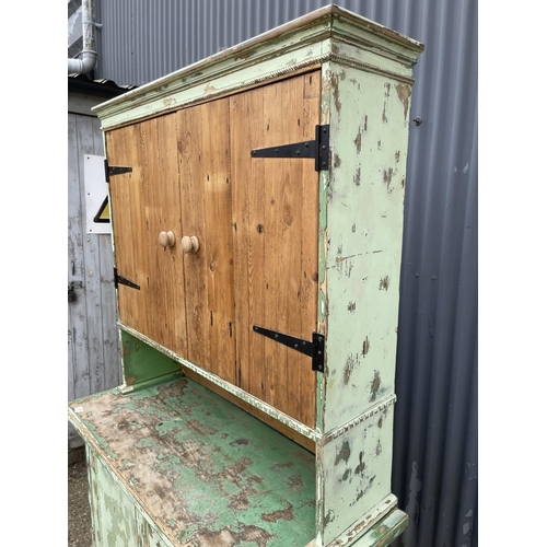 98 - A vintage green painted pine dresser with cupboard top and three drawer base 120x50x198