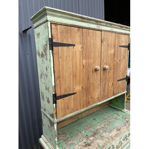 98 - A vintage green painted pine dresser with cupboard top and three drawer base 120x50x198