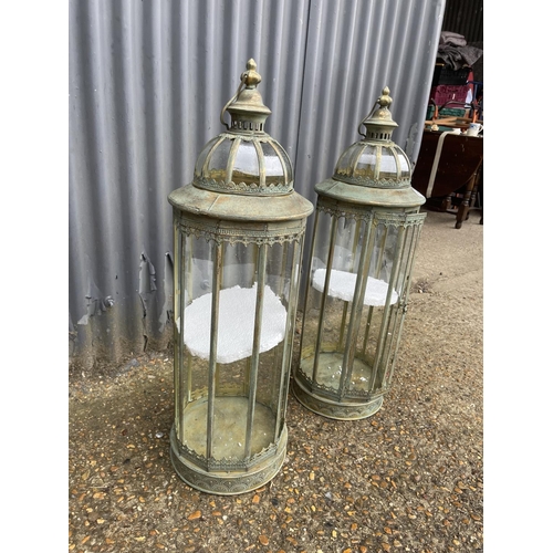 50F - A pair of copper and glass tall candle lanterns 87cm