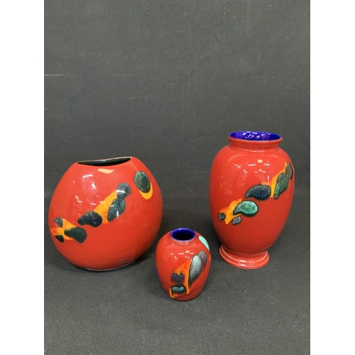 1044 - Three pieces of Poole Odyssey red patterned pottery, tallest vase 23 cms