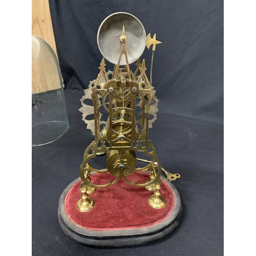 584 - Brass skeleton clock in glass dome with key and pendulum  (chip to base of dome)