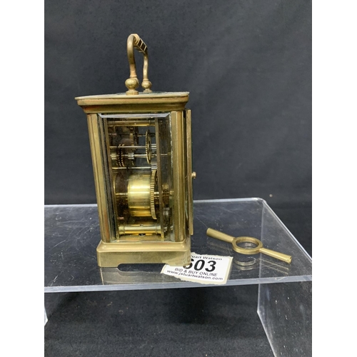 603 - Brass carriage clock with key, height 12cms, running order