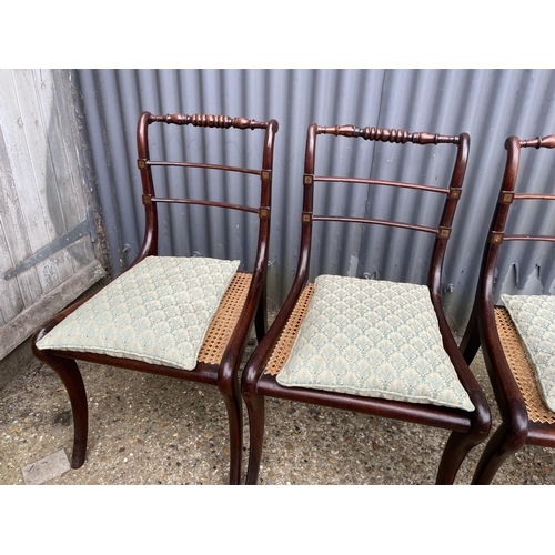 102 - A set of four victorian rosewood chairs with brass inlay and begere seat, recently refurbished