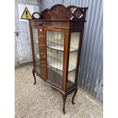 106 - An Edwardian mahogany display cabinet with leaded bow glass doors  107x 30x172