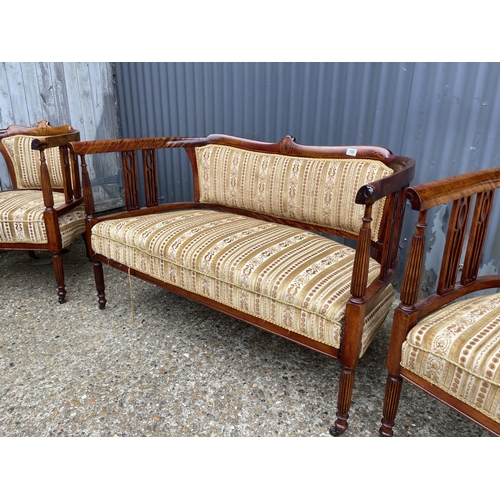 108 - An Edwardian mahogany three piece salon suite upholstered in gold