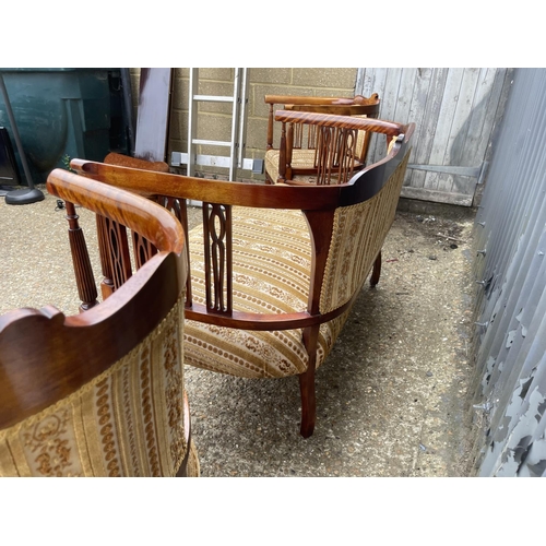 108 - An Edwardian mahogany three piece salon suite upholstered in gold