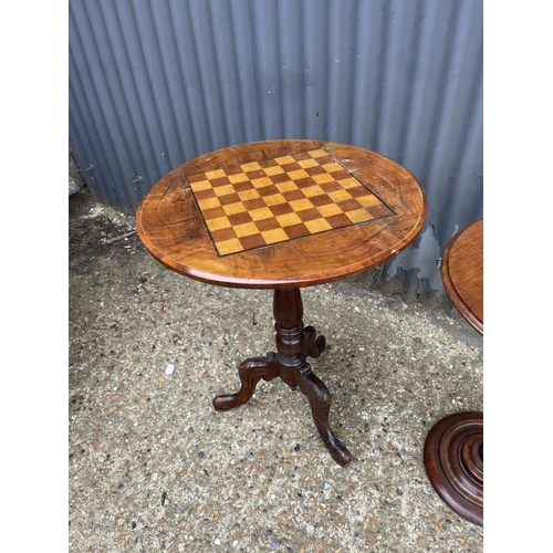 109 - A mahogany tripod games table together with another pedestal occasional table