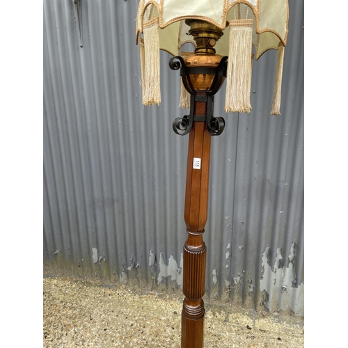 115 - A mahogany oil standard lamp 185cm high