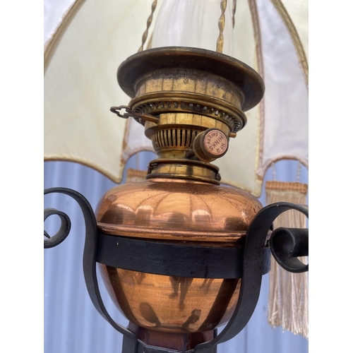 115 - A mahogany oil standard lamp 185cm high