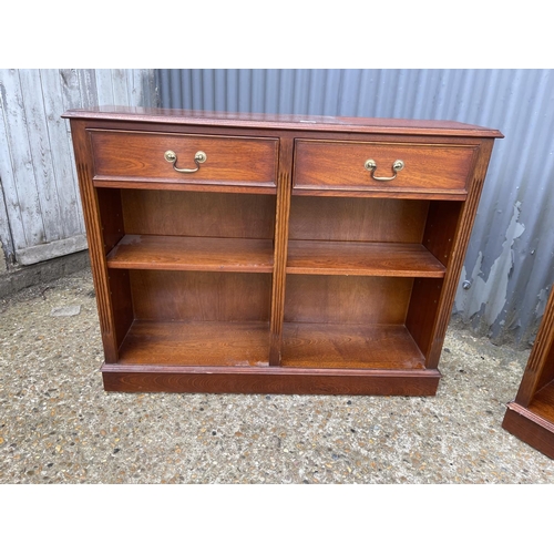 118 - A pair of repro mahogany two drawer open bookcases  107x30x84