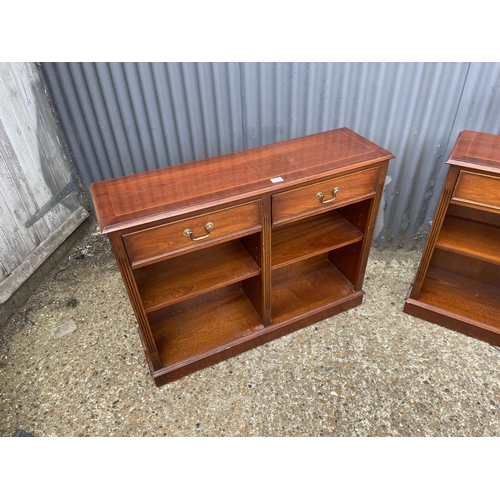 118 - A pair of repro mahogany two drawer open bookcases  107x30x84