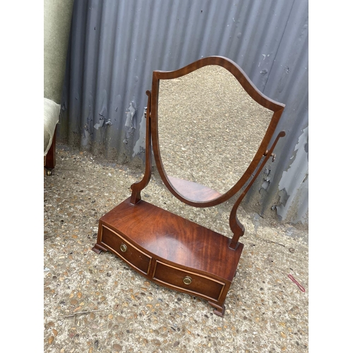 12 - An Edwardian green upholstered bedroom chair together with a mahogany swing mirror