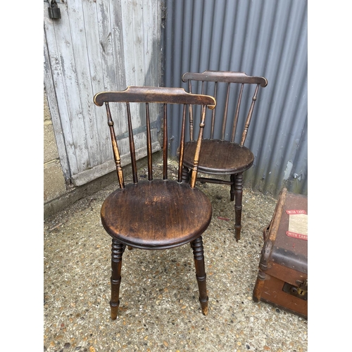 121 - A pair of Windsor chairs and a vintage travelling trunk