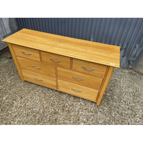 135 - A light oak lowboy chest of drawers