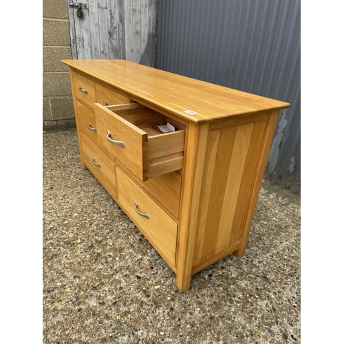 135 - A light oak lowboy chest of drawers