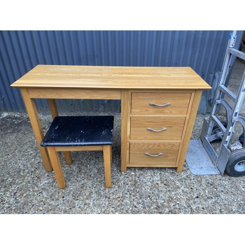 136 - A light oak dressing table with stool