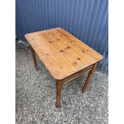 137 - A pine kitchen table with drawer 100x62