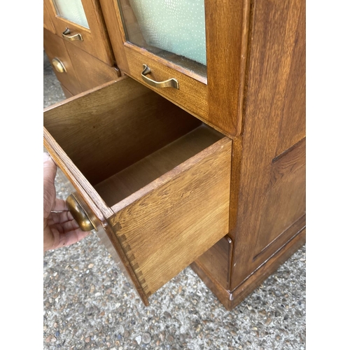 147 - A modern 9 drawer chest with brass cup handles 110x50x90