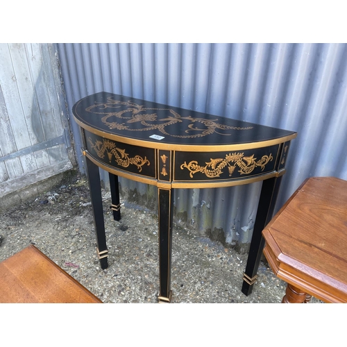 152 - A black and gold painted console table together with two other mahogany side tables