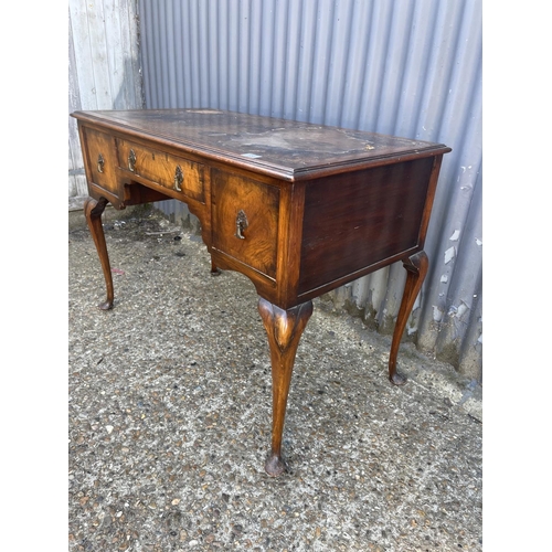 156 - A Queen Anne style three drawer writing table