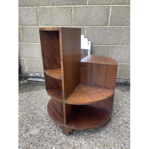 16 - A deco style walnut book table together with a frameless mirror