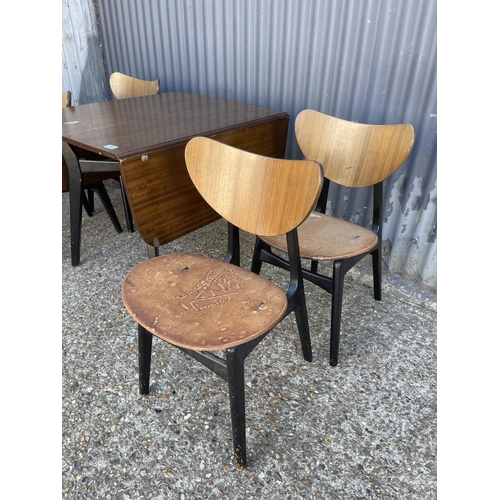 160 - A g plan mid century drop leaf table with four butterfly back chairs