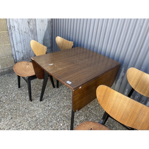 160 - A g plan mid century drop leaf table with four butterfly back chairs