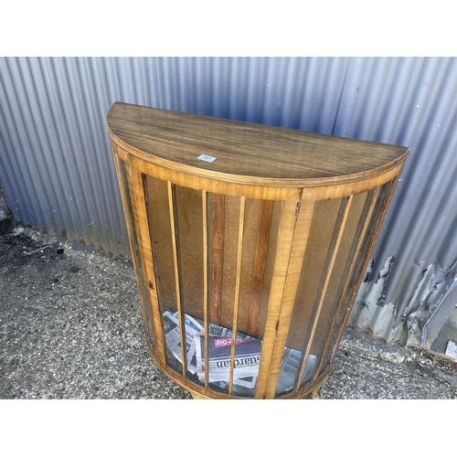 161 - A walnut bow front china cabinet