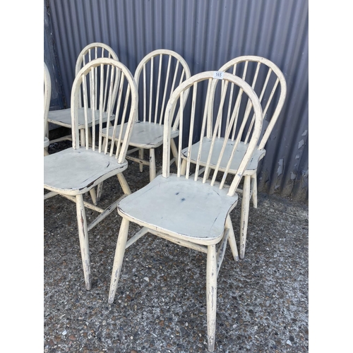 165 - A set of six white painted stick back chairs