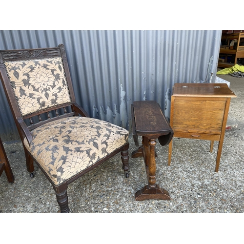 180 - An Edwardian chair together with two oak tables and an oak sewing box