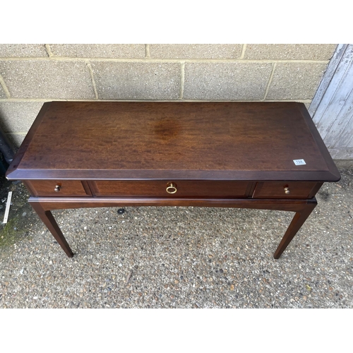 194 - A stag three drawer console table