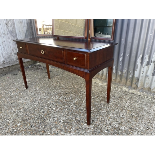 195 - A stag minstrel three drawer dressing table