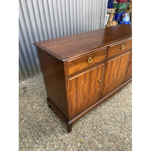 199 - A stag minstrel three drawer and three door sideboard