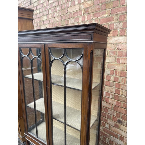 2 - An edwardian Mahogany display cabinet (One end glass missing)