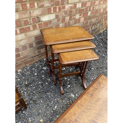 20 - A reproduction mahogany coffee table, nest of three and lamp table