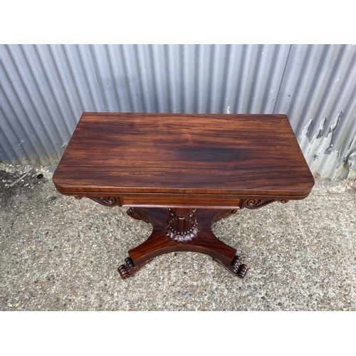 204 - A victorian rosewood fold over card table with baize surface