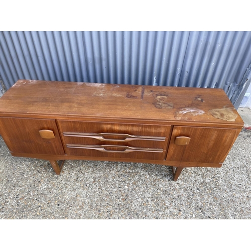 211 - A mid century teak sideboard AF to top